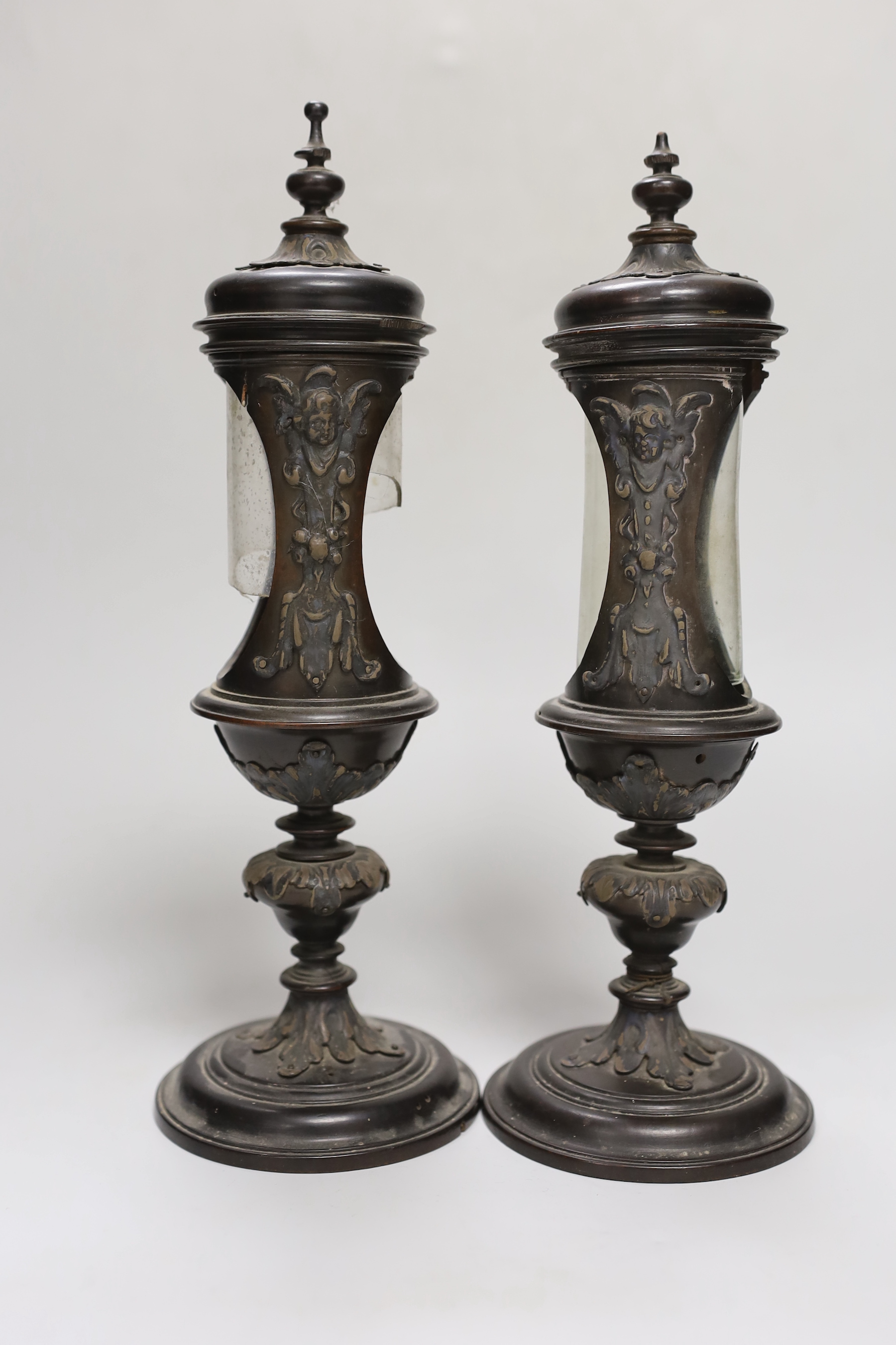 A pair of Victorian walnut reliquaries, 29cm